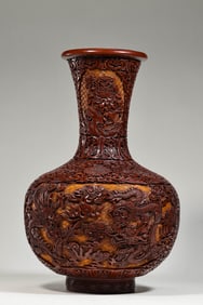 A Chinese celestial globe vase with a double dragon pattern playing with a pearl, dating back to the