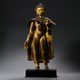 China15A gilt-bronze standing Buddha statue in the Mala style