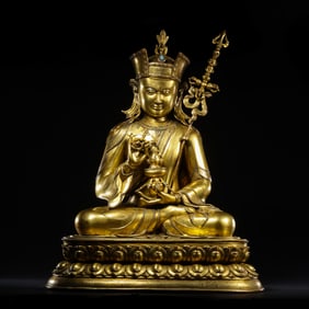 A Chinese Ming Dynasty gilt bronze statue of Guru Padmasambhava
