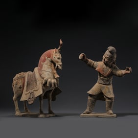 A group of Chinese Han Dynasty painted pottery horses and horse-leading figurines