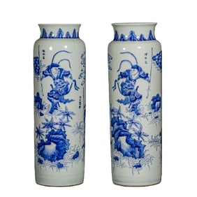 A pair of Chinese Qing Dynasty blue and white porcelain elephant-leg vases with figure and story