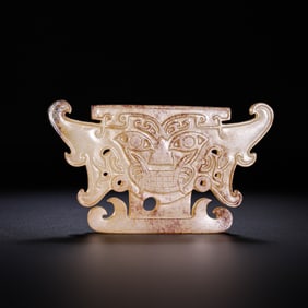 Chinese Han Dynasty jade pendant with animal mask design