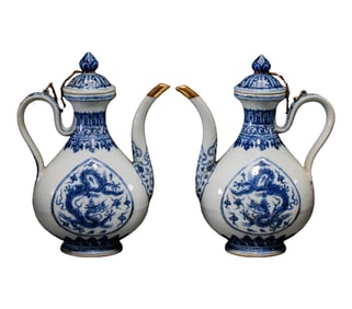 pair of Chinese Ming Dynasty blue and white dragon-patterned ewers