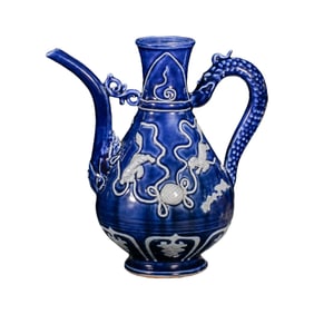 Chinese Yuan Dynasty celadon-glazed ewer with white dragon handle