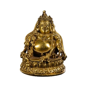 A gilt bronze seated statue of the God of Wealth from the Ming Dynasty of China.