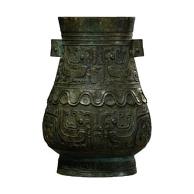 Chinese Shang and Zhou Dynasty bronze vessel with animal-face design and pierced handles