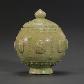 Chinese Sui Dynasty celadon covered jar with applied drum nail pattern