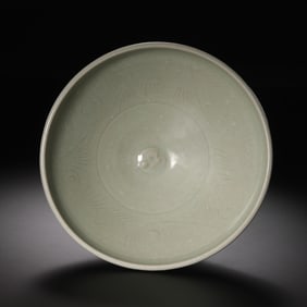 A moon-white glazed bowl with carved and appliqué decoration from the Yaozhou kiln during the late