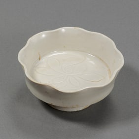 A white porcelain stem cup with lotus flower design from the Ding kiln of the Northern Song Dynasty,