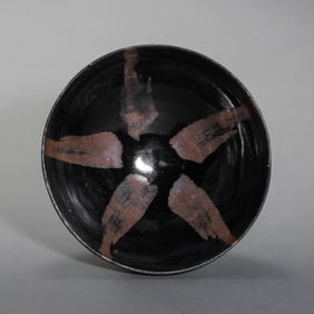 A large bowl with iron-patterned dog licking design from the Cizhou ware kiln of the Northern Song