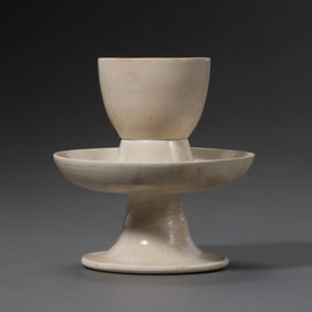 A set of tall-footed white porcelain cups and saucers from the Tang Dynasty of China