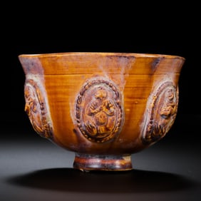 Small yellow-glazed cup with applied decoration from the Sui Dynasty of China