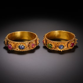 pair of pure gold and gemstone-inlaid Chinese Qing Dynasty bracelets
