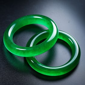 A pair of Chinese Qing Dynasty jade bracelets