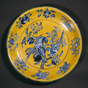 Large yellow-glazed blue-and-white floral and bird pattern plate from the Xuande period of the Ming