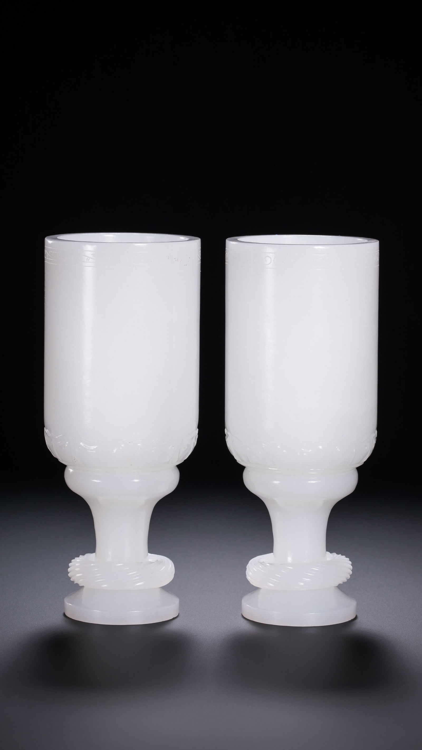 A pair of Chinese Qing Dynasty Hetian white jade cups (1 of 12)