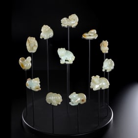 A set of twelve Chinese zodiac animals made of Hetian white jade from the Qing Dynasty.