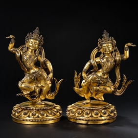 A pair of Chinese Ming Dynasty Yongle period gilt bronze standing Buddha statues
