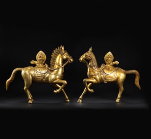 A pair of Chinese gilt bronze Buddhist galloping horses
