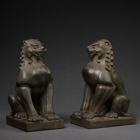 A pair of Chinese Tang Dynasty bluestone seated lion statues