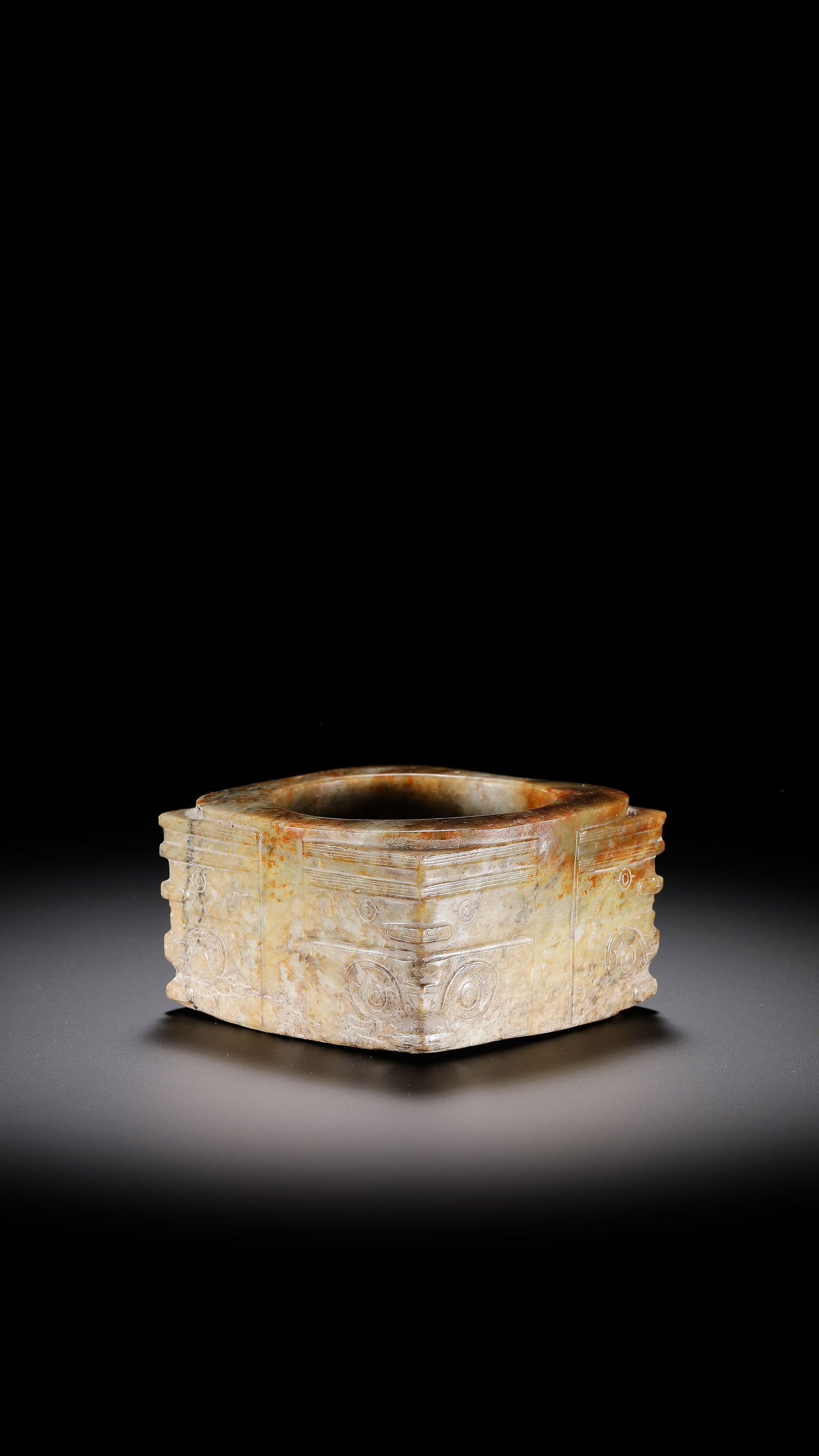 Jade Cong with Beast-Face Pattern from the Han Dynasty in China: H. 5.5 cm. W. 9.2 cm. Weight. 515 gram.