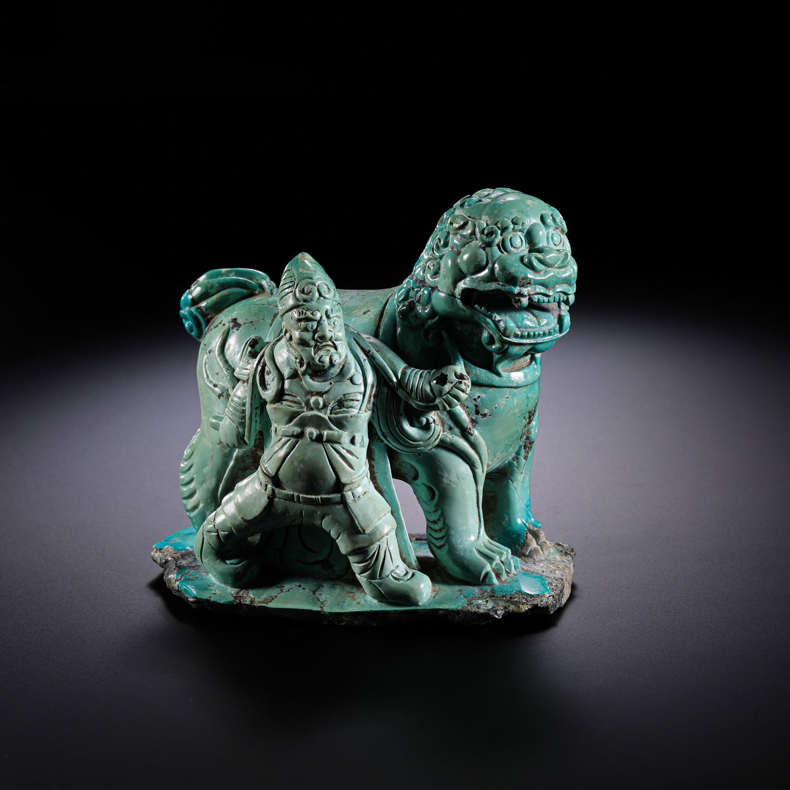 A turquoise statue of a Central Asian man leading a lion from the Liao Dynasty in China. (1 of 10)