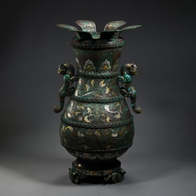 A double-eared flower-shaped vase inlaid with gold and silver from the Warring States period of