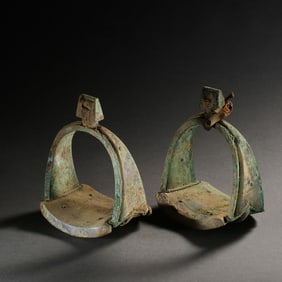 A pair of Chinese Liao Dynasty agate bronze stirrups