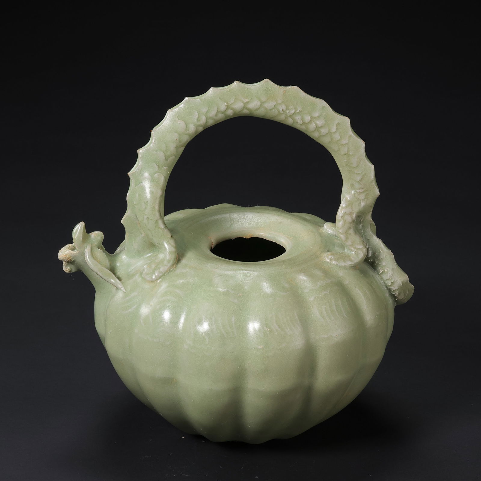 A celadon melon-shaped ewer with a handle, made in the Yue kiln of the Tang Dynasty, China (1 of 8)