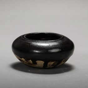 A black-glazed water dropper from the Cizhou kiln of the Northern Song Dynasty in China.