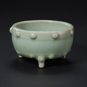 A celadon plum blossom tripod censer from the Longquan kiln of the Southern Song Dynasty, China.