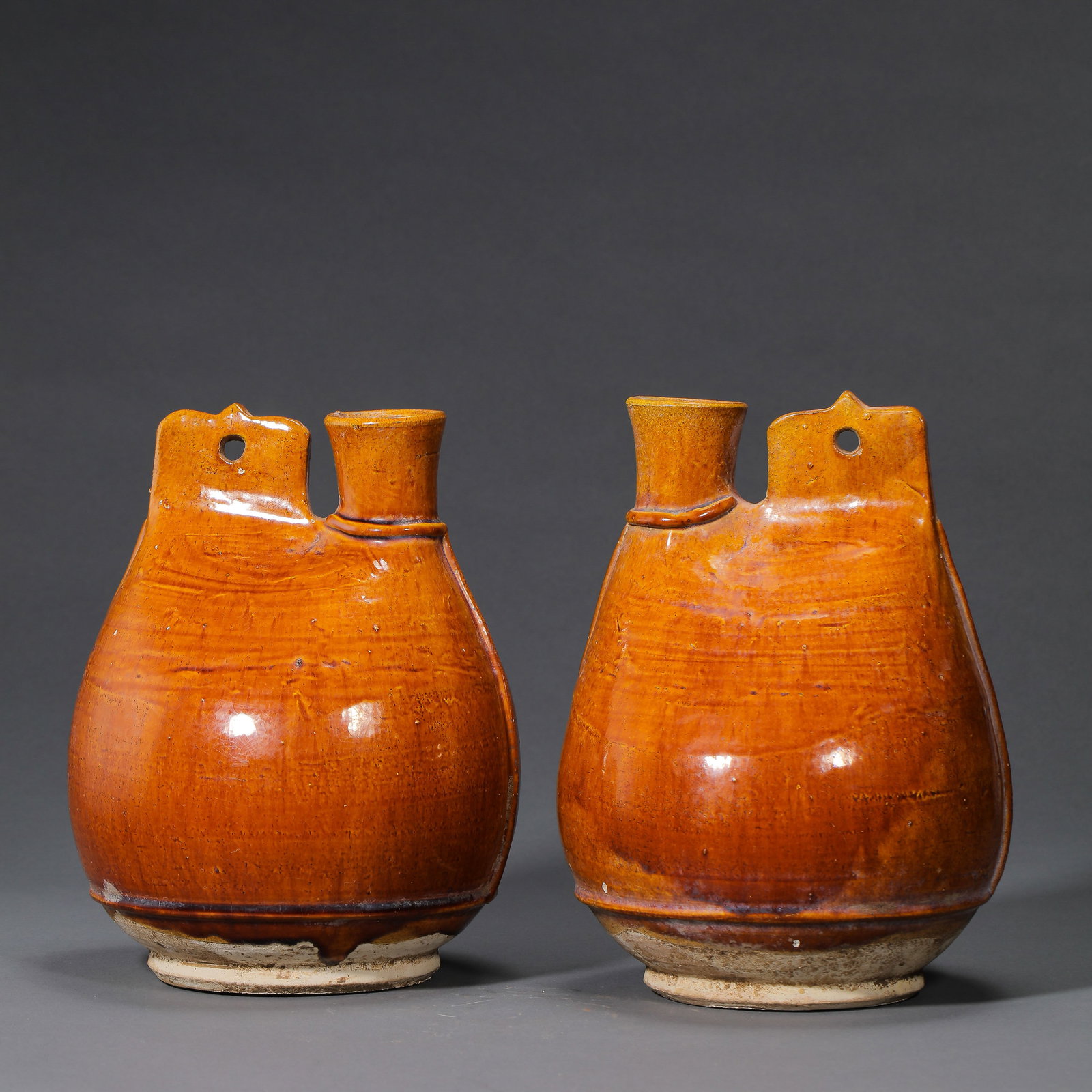 A pair of Chinese Liao Dynasty yellow-glazed leather flasks (1 of 13)