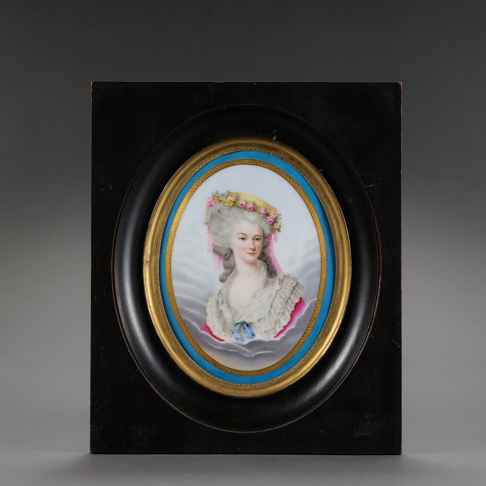 A FINE OVAL PORCELAIN PORTRAIT PLAQUE OF A LADYPROBABLY GERMAN OR FRENCH, LATE 19TH / EARLY 20TH: Description This exquisite oval porcelain plaque features a hand-painted portrait of an elegant lady, a popular genre in European decorative arts during the late Victorian and Belle Époque eras. The