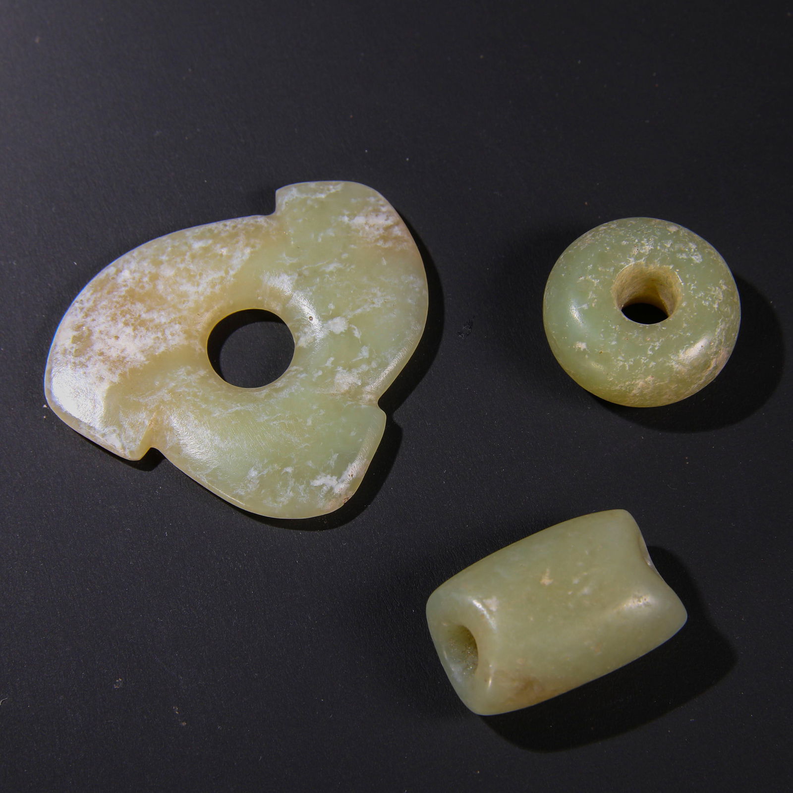 RARE GROUP OF THREE JADE ORNAMENTSHONGSHAN CULTURE, NEOLITHIC PERIOD (C. 3500-3000 BC) (1 of 4)