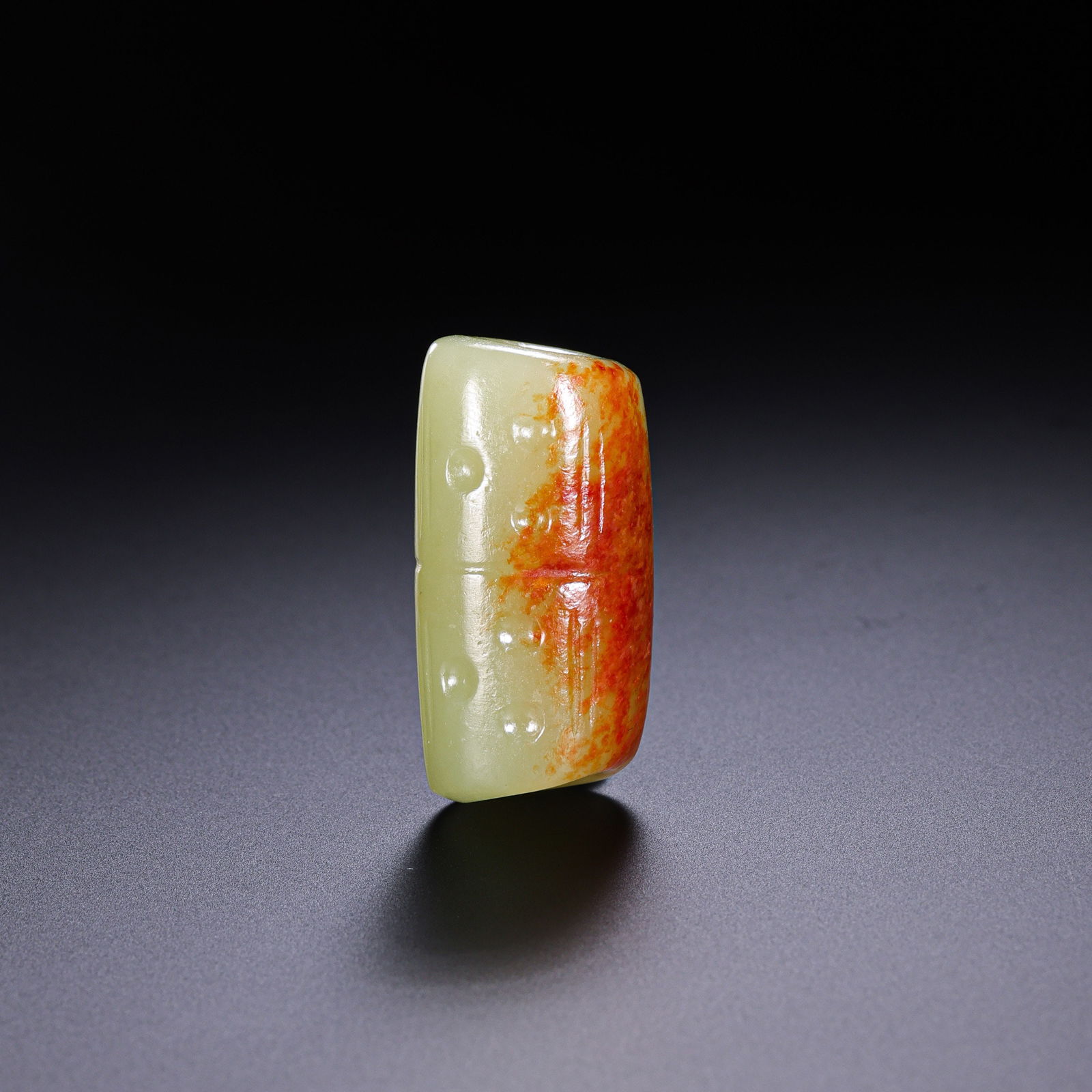 A RARE AND MAGNIFICENT YELLOW JADE TUBULAR PENDANT (LEIZI) , HONGSHAN CULTURE (C. 3500–2500 BC): Description This exceptional tubular bead, known as a 'Leizi', is fashioned from a rare, high-quality yellow nephrite jade (huang-yu). The stone possesses a dense, waxy luster and a warm honey-colored