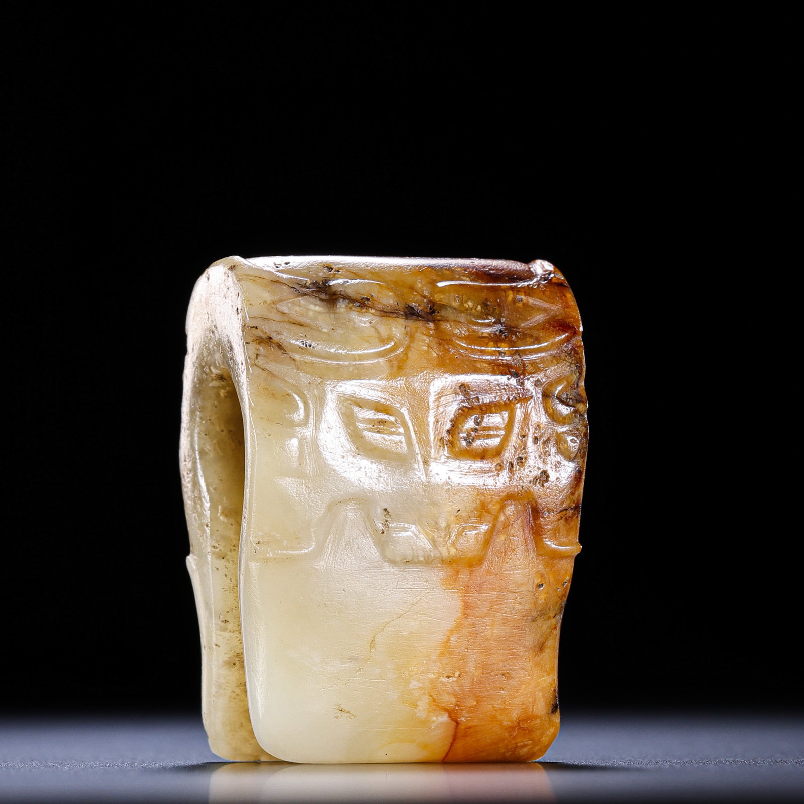 A RARE YELLOW JADE 'ANIMAL MASK' STRUCTURAL FITTING (KAZI)LATE NEOLITHIC PERIOD TO EARLY WESTERN: Description This enigmatic and highly specialized jade object, traditionally termed a 'Kazi' (Fitting/Fastener), is carved from a rare and luminous variety of yellow jade (huang-yu). The stone exhibit