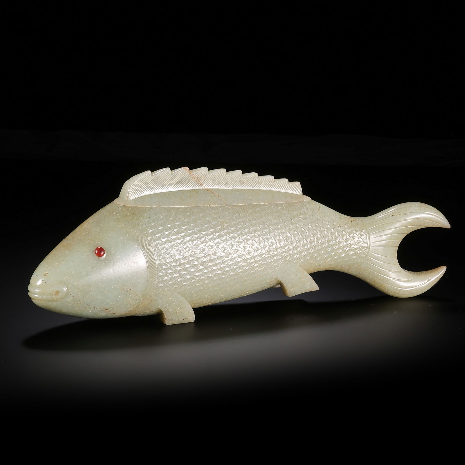 A MONUMENTAL AND RARE NEPHRITE JADE 'FISH' COVERED BOX AND COVERMING DYNASTY OR EARLIER (14TH –: Description This extraordinary vessel is masterfully carved from a single, substantial block of Hetian jade, fashioned into the lifelike form of a large carp (li-yu). The stone exhibits a warm, unctuo