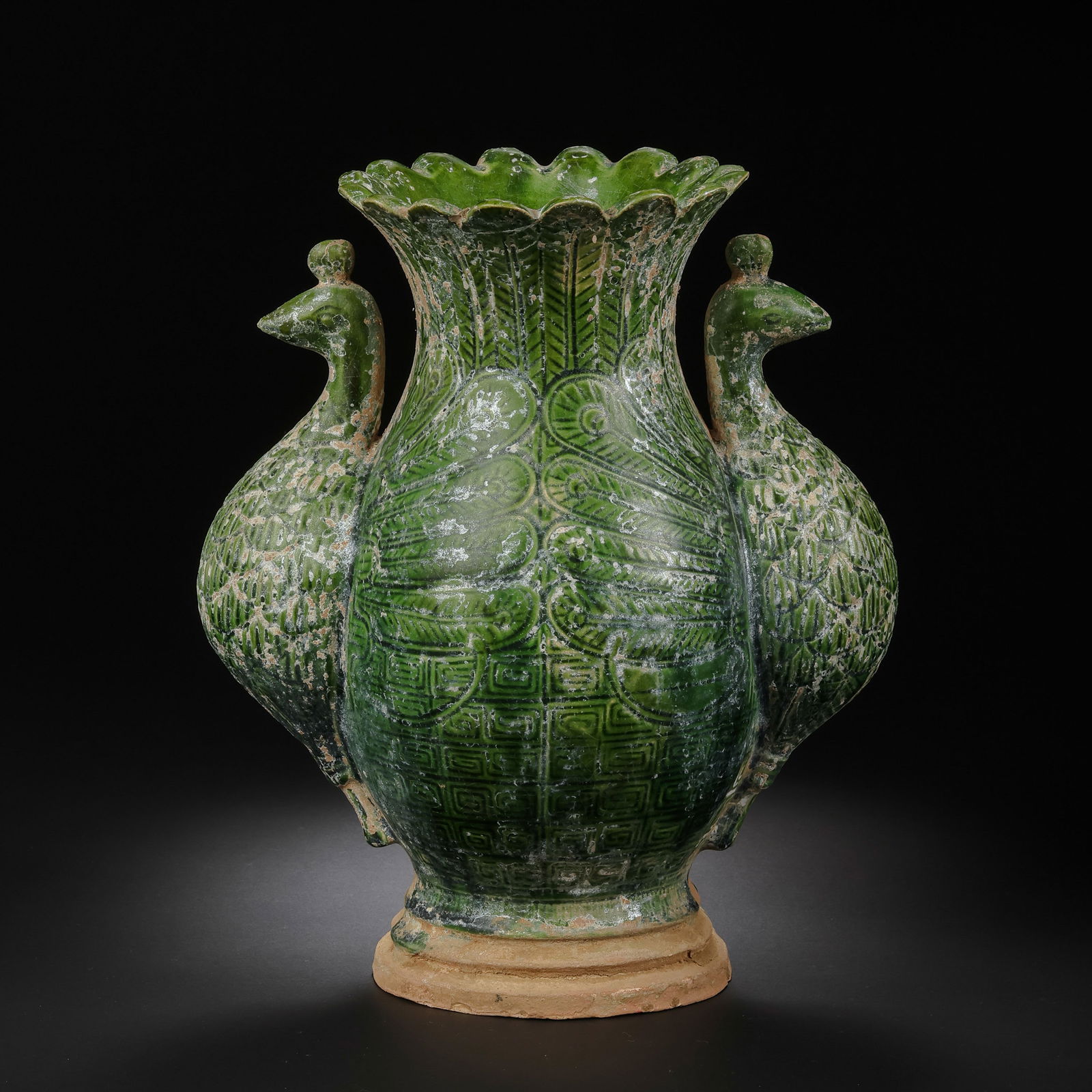 A RARE 'PEACOCK-GREEN' GLAZED FOLIATE-RIM 'DOUBLE-PHOENIX' VASEXIKOU GUAN WARE, SOUTHERN SONG: Description This exceptional vase is a masterpiece of Southern Song ceramic sculpture, attributed to the prestigious Xikou kilns (part of the Longquan Guan ware tradition). The vessel features an eleg