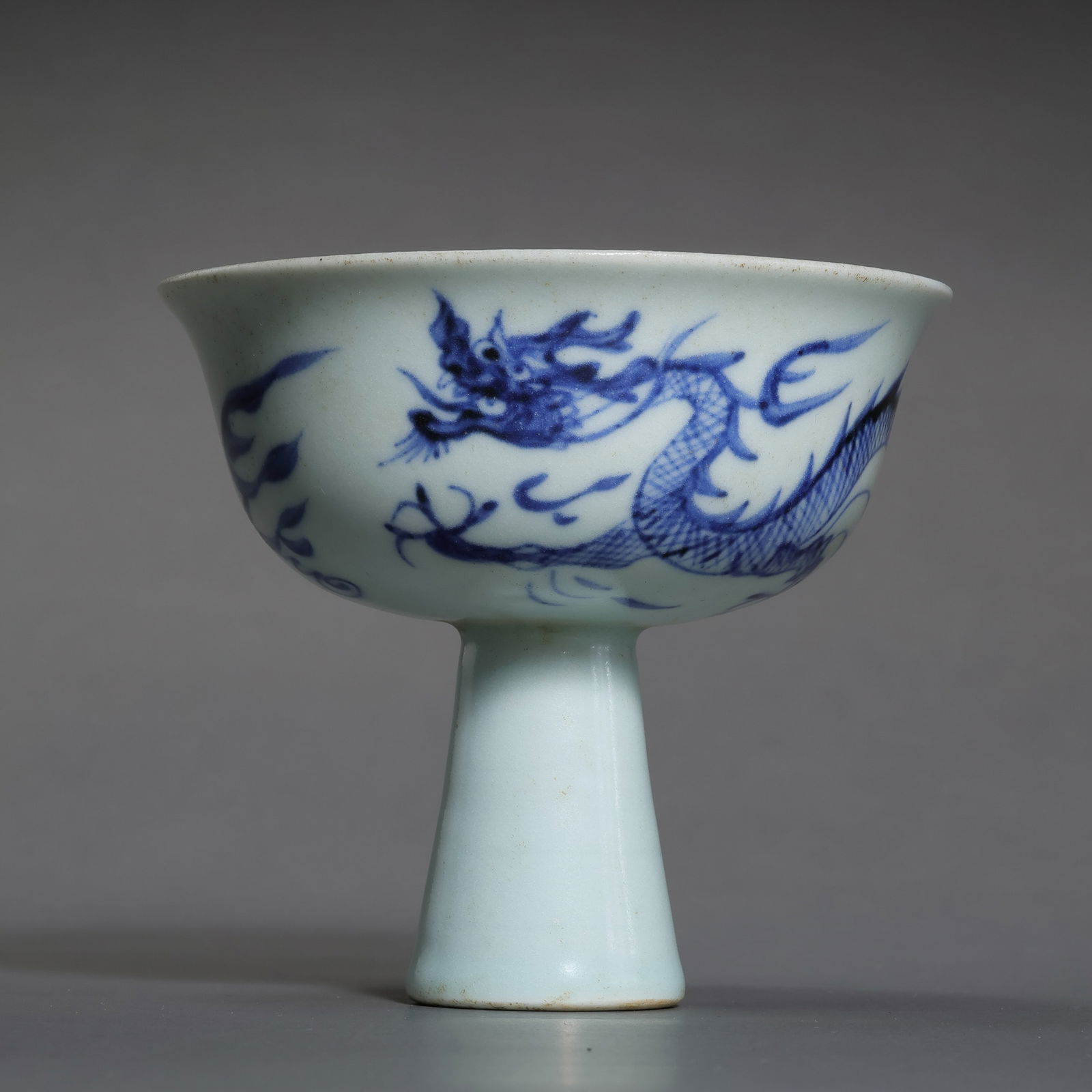 A RARE AND IMPORTANT BLUE AND WHITE 'DRAGON' STEM CUPYUAN DYNASTY (1271–1368) (1 of 11)