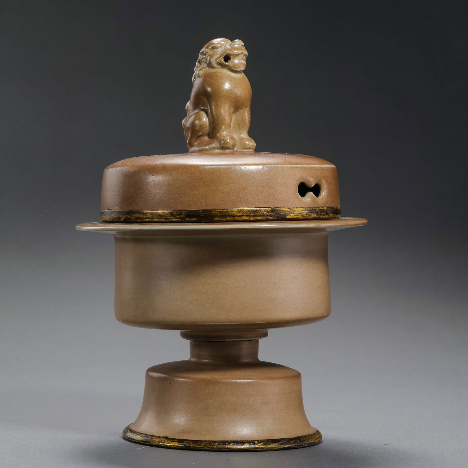 A RARE AND MAGNIFICENT METAL-BOUND 'MIHUANG' GLAZED 'LION' CENSER AND COVERPOSSIBLY NORTHERN SONG TO: Description This monumental two-section censer is a rare masterpiece of early Northern Chinese stoneware. The lower globular body is supported by three powerful feet, while the domed, openwork cover i