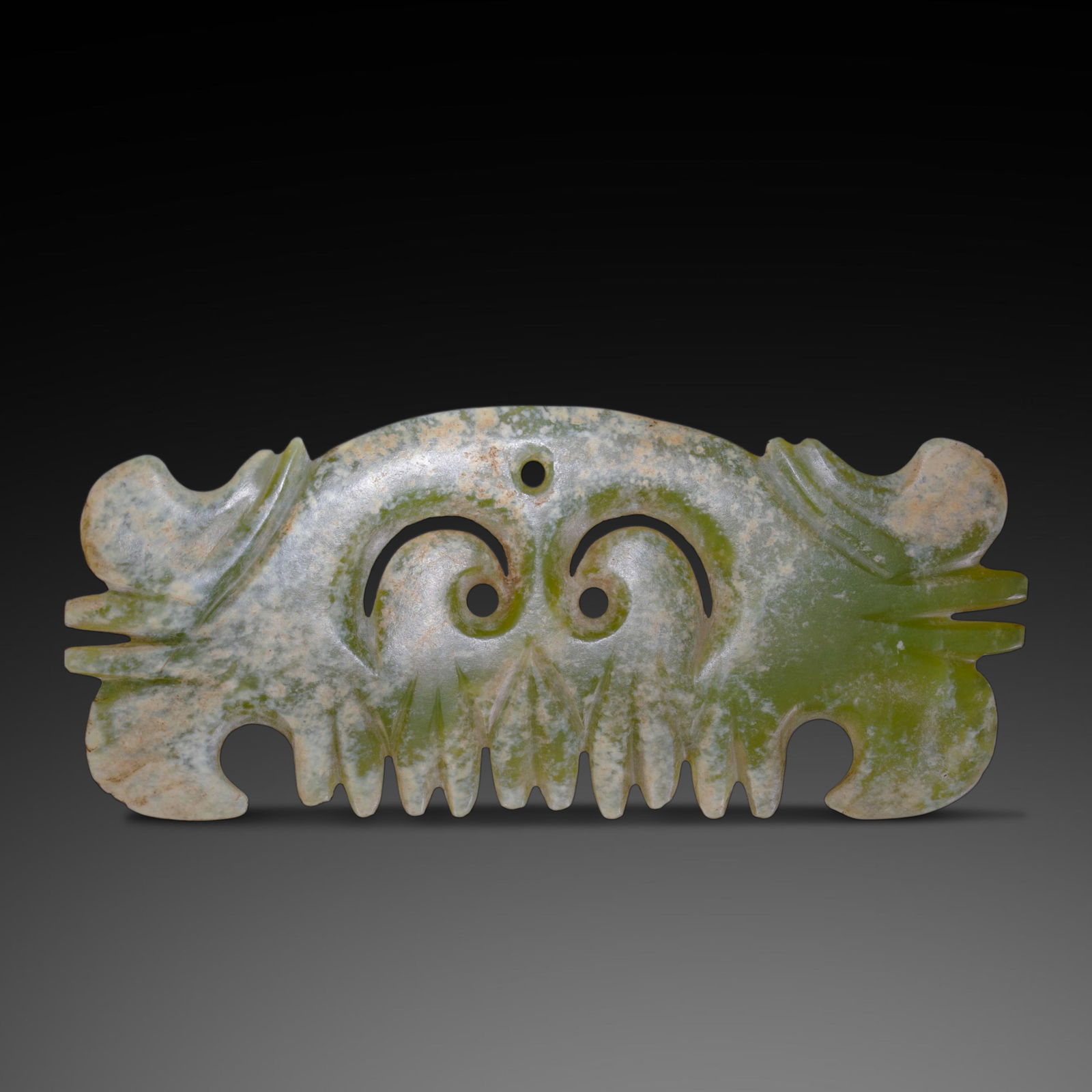 A RARE AND MAGNIFICENT GREENISH-YELLOW JADE 'TOOTHED' PENDANTHONGSHAN CULTURE, NEOLITHIC PERIOD (C.: Description The ornament is exquisitely fashioned from a translucent greenish-yellow jade (nephrite), exhibiting a sleek, horizontally elongated form. The upper edge is smoothly curved, while the lowe
