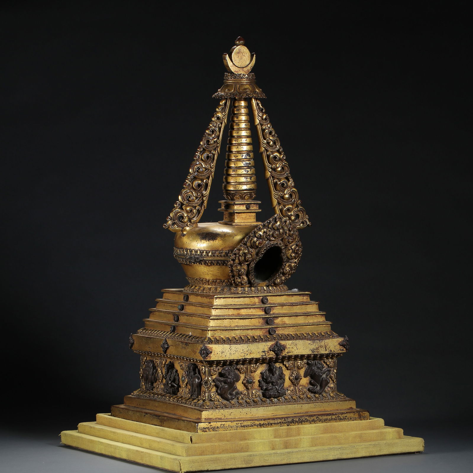 A RARE AND MAGNIFICENT LARGE GILT-BRONZE RITUAL STUPAMING DYNASTY, 15TH - 16TH CENTURY: Description The stupa is of monumental proportions and masterfully cast in several sections. It is modeled in the classical Tibetan-style Chorten form, representing the mind of the Buddha. The square,