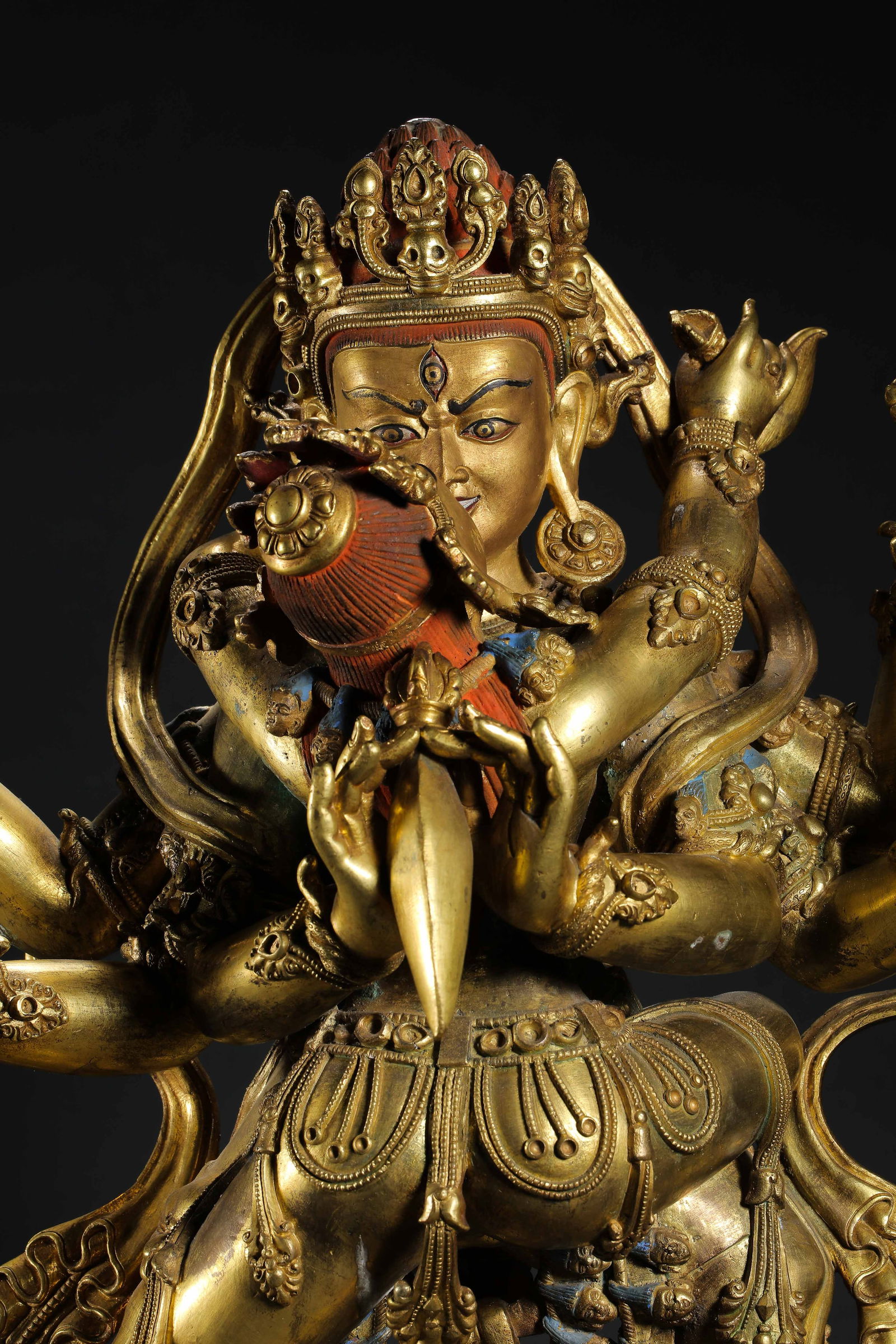 A MAGNIFICENT AND MASSIVE GILT-BRONZE FIGURE OF A TANTRIC DEITY IN YAB-YUMTIBET OR CHINA, MING (1 of 14)