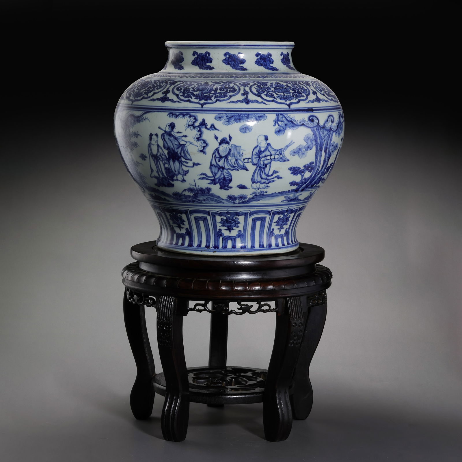A MAGNIFICENT AND RARE BLUE AND WHITE 'EIGHT IMMORTALS' JAR,GUANMING DYNASTY, JIAJING PERIOD: Description This monumental jar, or guan, is powerfully potted with a broad, rounded shoulder tapering down to a slightly flared foot. The expansive body provides a grand canvas for the elaborate narr