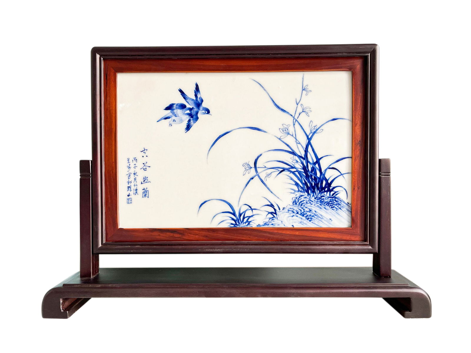 A RARE BLUE AND WHITE 'BIRD AND FLOWER' PORCELAIN TABLE SCREENBY WANG BU (1898-1968), MID-20TH: Description The lot features a rectangular porcelain plaque masterfully painted in underglaze blue, inset into a custom-carved wooden table screen. The plaque is the work of the 20th-century master Wa