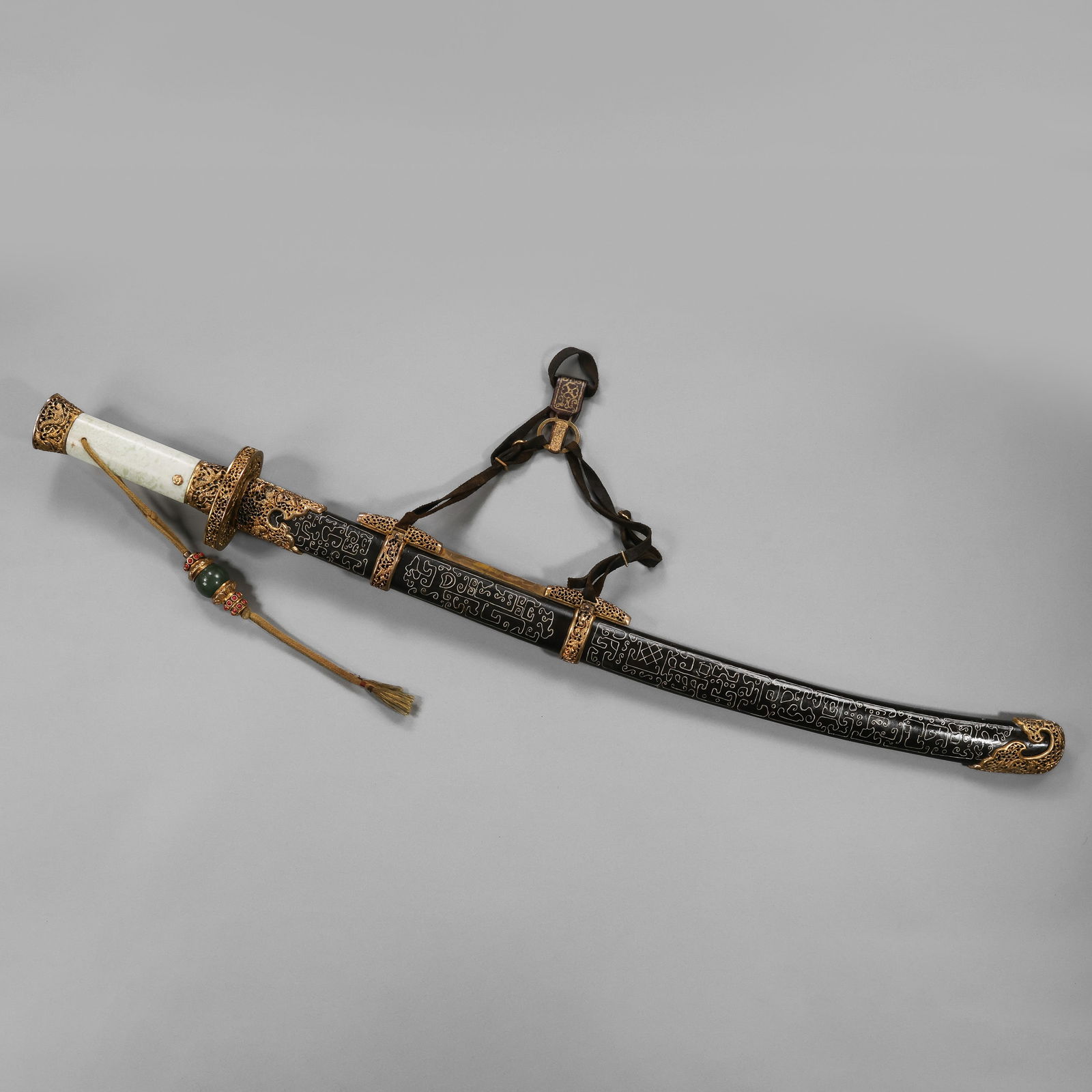 A MAGNIFICENT AND HIGHLY IMPORTANT IMPERIAL GOLD AND SILVER-INLAID SABER (YAODAOWITH JADEITE (1 of 12)