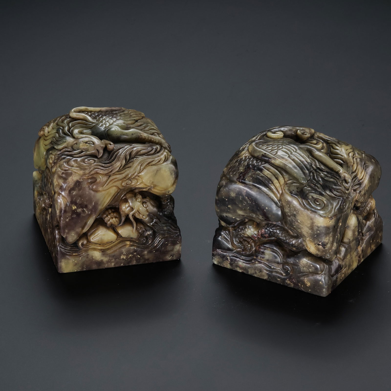 A RARE AND MAGNIFICENT PAIR OF SHOUSHAN STONE 'DRAGON AND PHOENIX' SEALSQING DYNASTY (1644–1911): Description This exceptional pair of seals is masterfully carved from high-quality Shoushan stone, celebrated for its smooth, wax-like texture and warm, honey-colored hues with natural veining. The se