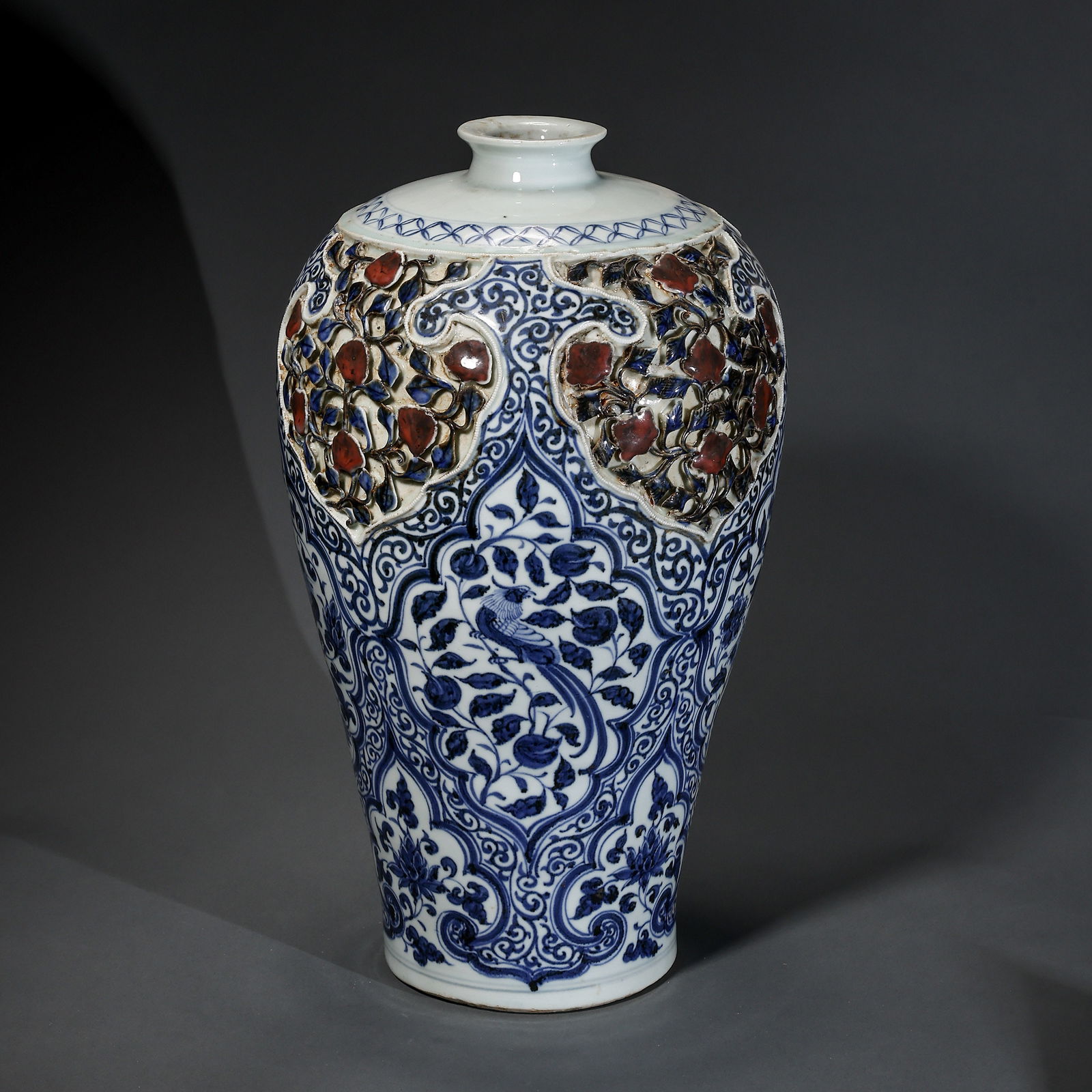 A RARE AND MAGNIFICENT BLUE AND WHITE AND UNDERGLAZE-RED 'MEIPING'EARLY MING DYNASTY, 14TH – 15TH: Description This monumental Meiping (Prunus Vase) is a masterwork of ceramic engineering from the early Ming Dynasty. The vessel features a classic high-shouldered form, tapering gracefully to a sligh
