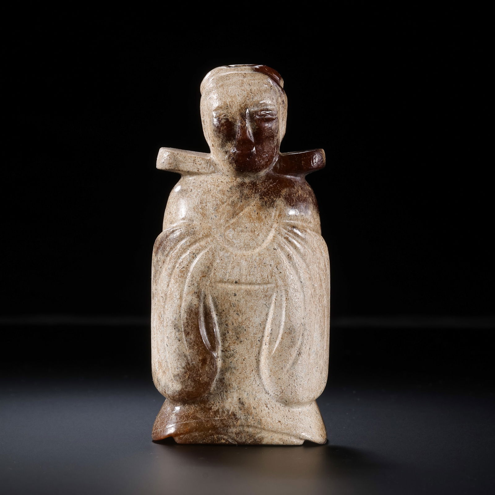 A RARE AND FINELY CARVED WHITE JADE FIGURE OF A STANDING ATTENDANTHAN DYNASTY OR LATER (C. 2ND: Description This dignified figure is masterfully sculpted in the round from a solid block of Hetian white jade, exhibiting a warm, translucent tone characteristic of high-quality nephrite. The figure