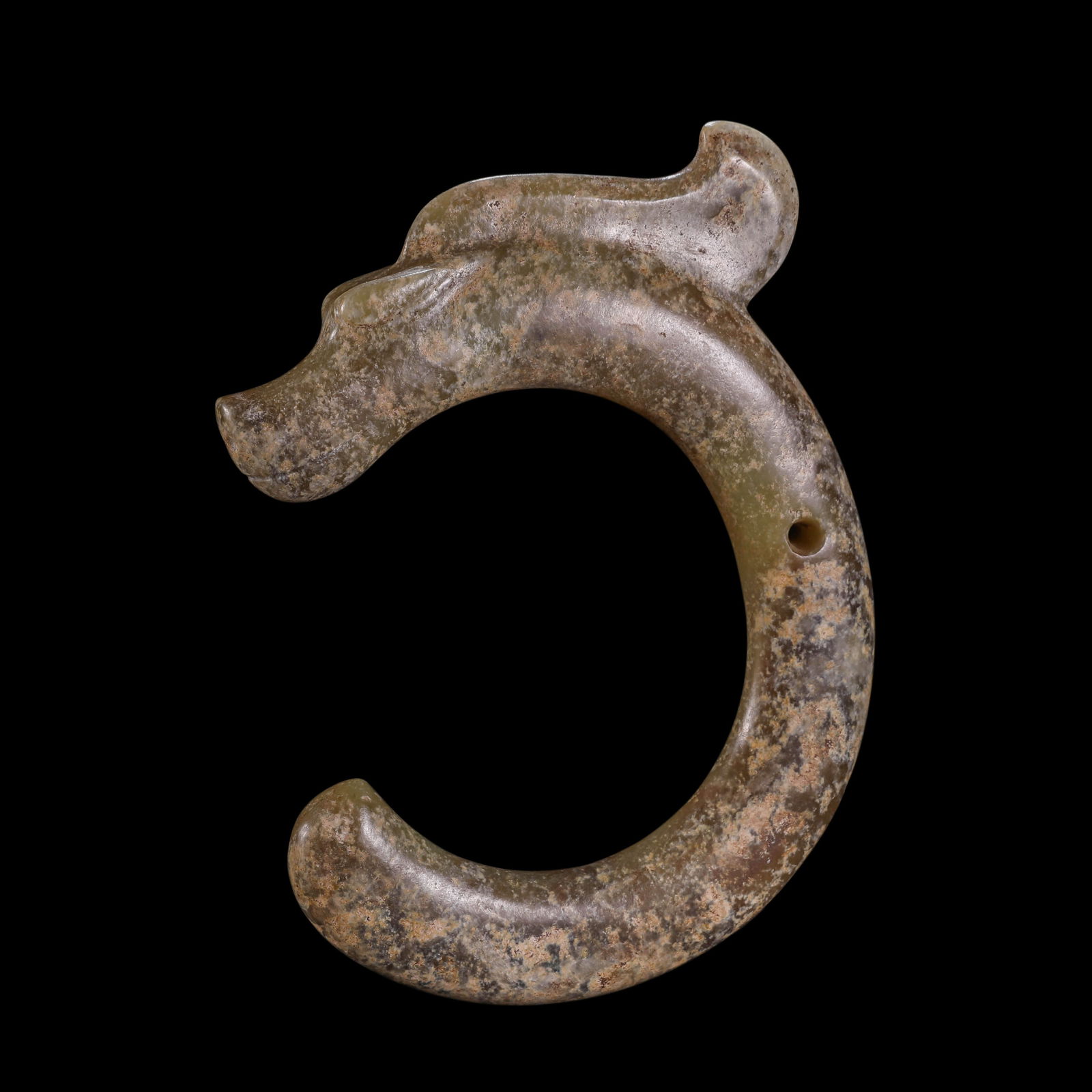 MAGNIFICENT AND HIGHLY IMPORTANT GREENISH-YELLOW JADE C-SHAPED DRAGONHONGSHAN CULTURE, NEOLITHIC: Description This extraordinary ritual object is masterfully fashioned from a substantial and translucent section of greenish-yellow jade (nephrite). The dragon is expertly carved into a bold, rhythmic